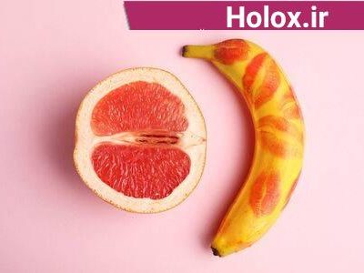 128831055-fresh-grapefruit-and-banana-with-red-lipstick-marks-on-pink-background-sex-concept